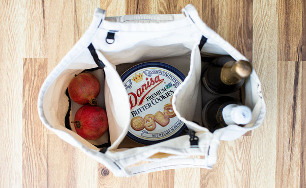 The three major holiday food groups (pomegranates, butter cookies, champagne) in a Natural Organic Cotton Truck.